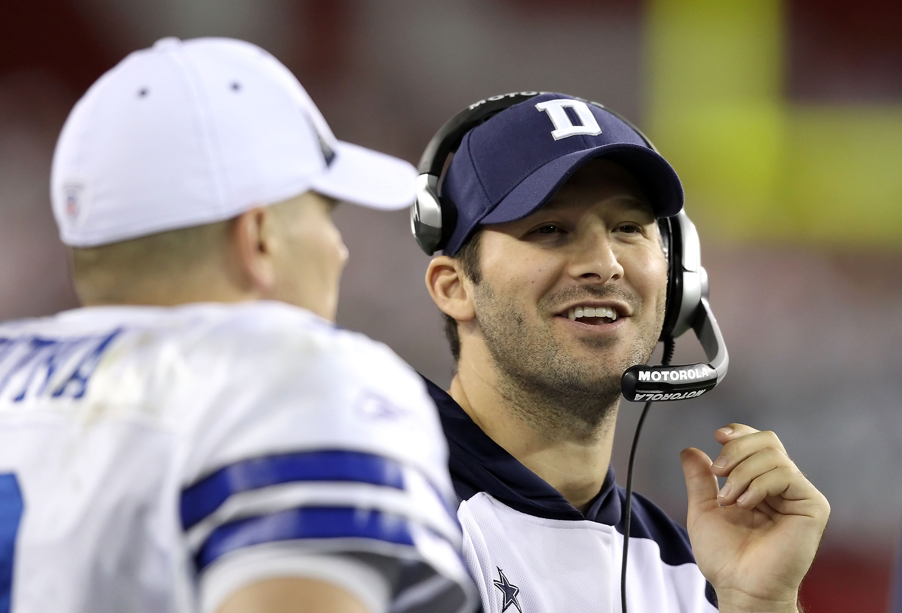 GLENDALE, AZ - DECEMBER 25:  Quarterbacks Tony Romo and Jon Kitna #3 of the Dallas Cowboys talk on the sideline during the NFL game against the Arizona Cardinals at the University of Phoenix Stadium on December 25, 2010 in Glendale, Arizona. The Cardinals