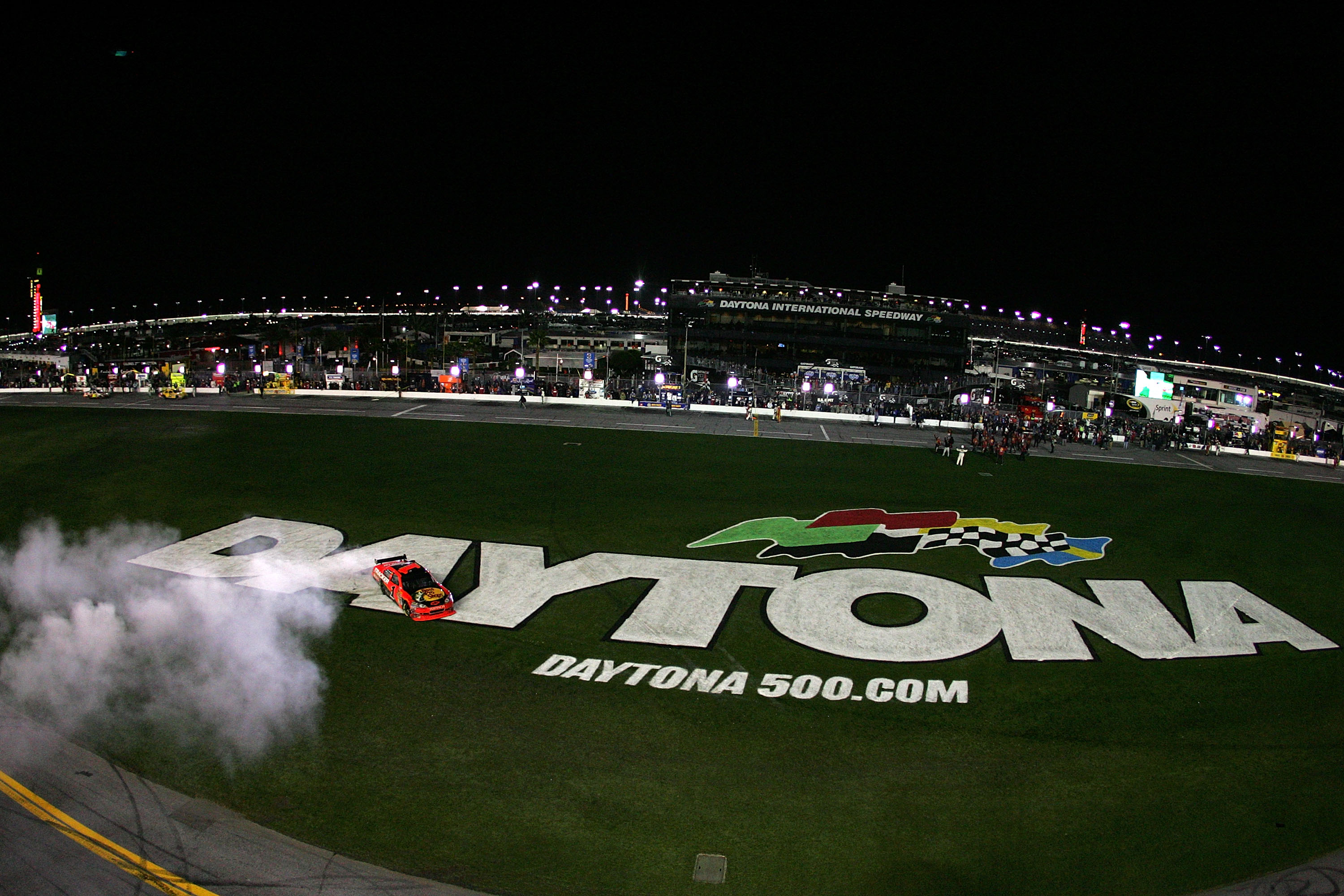 DAYTONA BEACH, FL - FEBRUARY 14:  Jamie McMurray, driver of the #1 Bass Pro Shops/Tracker Boats Chevrolet, celebrates with a burnout after winning the NASCAR Sprint Cup Series Daytona 500 at Daytona International Speedway on February 14, 2010 in Daytona B