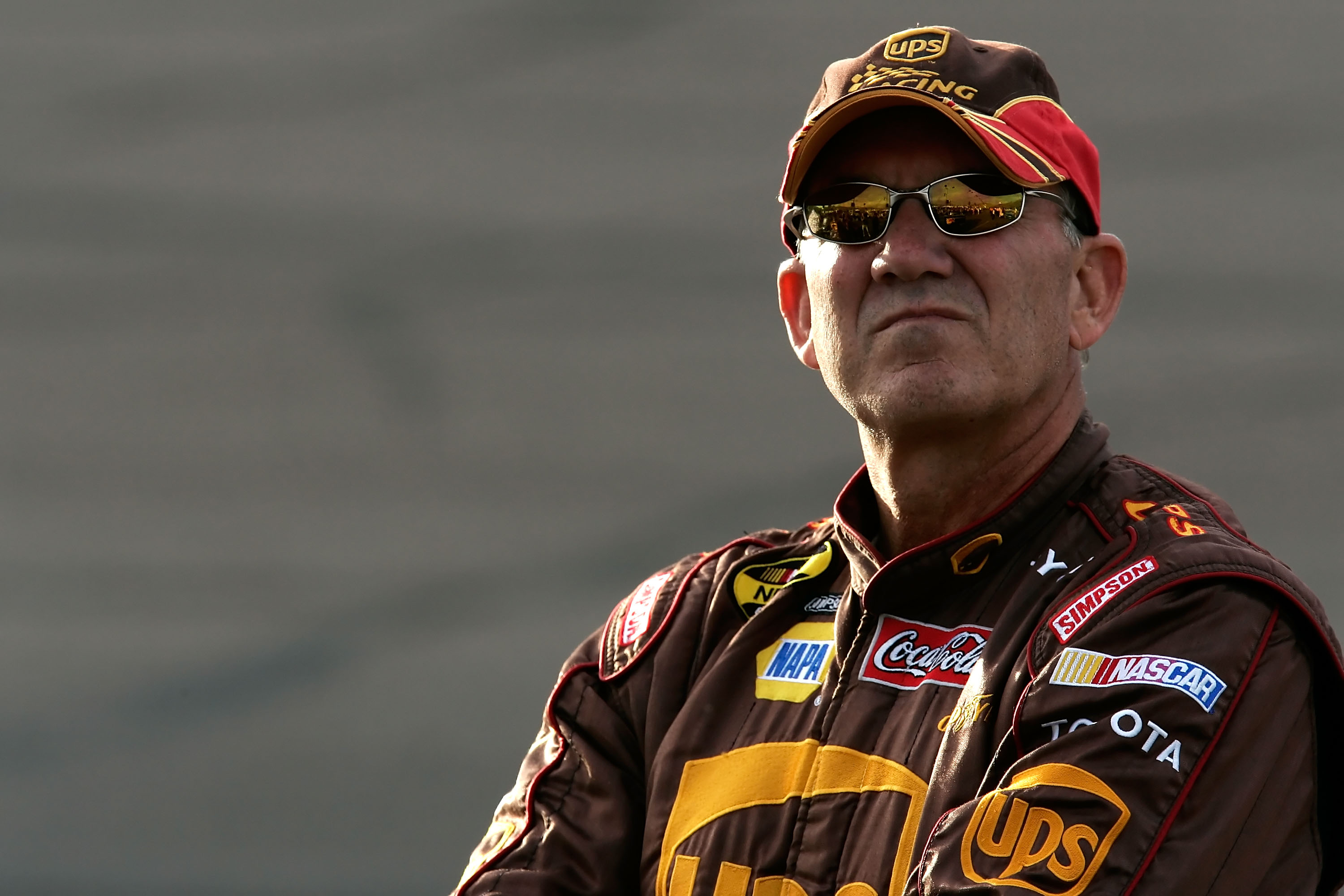 AVONDALE, AZ - NOVEMBER 09: Dale Jarrett, driver of the #44 UPS Toyota, stands on the grid during qualifying for the NASCAR Nextel Cup Series Checker Auto Parts 500 at Phoenix International Raceway on November 9, 2007 in Avondale, Arizona.  (Photo by Jaso