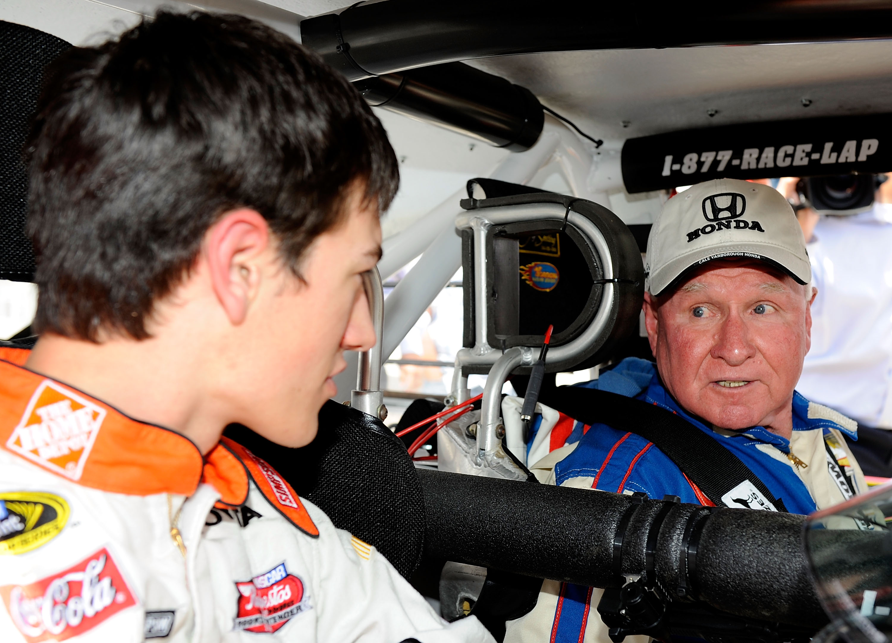 DARLINGTON, SC - APRIL 22:  NASCAR Sprint Cup driver Joey Logano takes advice from NASCAR legend Cale Yarborough during a promotional event for the Southern 500 on April 22, 2009 at Darlington Raceway in Darlington, South Carolina.  (Photo by Rusty Jarret