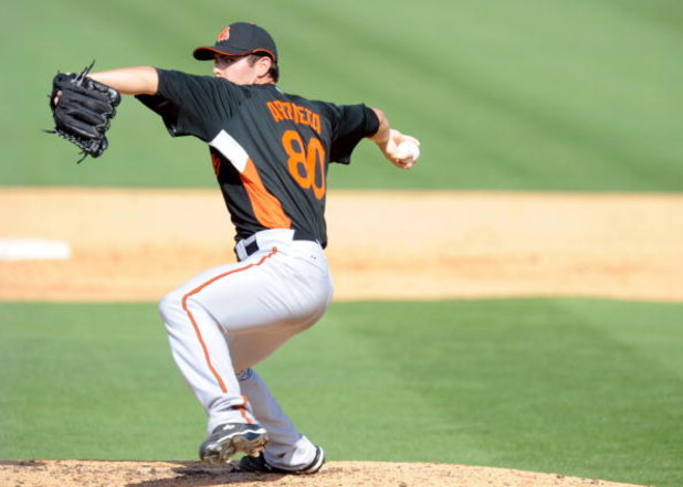 JUPITER, FL - FEBRUARY 27: Jake Arrieta #80 of the Baltimore Orioles pitches against the Florida Marlins during a spring training game at Roger Dean Stadium on February 27, 2009 in Jupiter, Florida. (Photo by Rob Tringali/Getty Images)