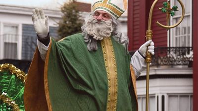 Parade participant dressed as Saint Patrick waving to the crowd during the St. Patrick's Day Parade in Boston, Massachusetts, U.S. on March 16, 2008.