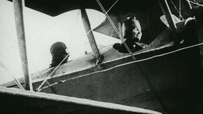 Still from the film Deliverance, 1919. The story of Helen Keller and Anne Sullivan. View shows Keller in the cockpit/front seat of an airplane.