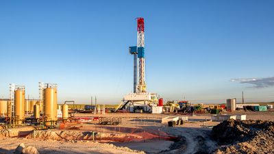 A lone fracking rig on a prairie.