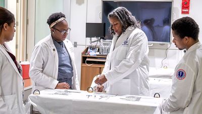 Andrea Hayes Dixon (center) Dean of the Howard University College of Medicine works with medical students at Howard University College of Medicine, Washington, D.C. in 2023