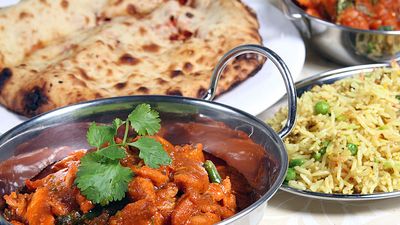 Indian meal of chicken keema, curry, rice, and naan bread.  (Pakistani meal; curried food; Indian food; Pakistani food)