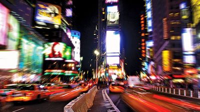 Times Square. Night view of Times Square with traffic calming devices, square in Midtown Manhattan, New York City, formed by the intersection of Seventh Avenue, 42nd Street, and Broadway. Circa 2009