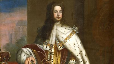 George I (1660-1727) by Sir Godfrey Kneller, c. 1714. Portrait showing him in his coronation robes, wearing the chain of the Order of the Garter. His right hand rests on the Orb and the Crown is on the table.