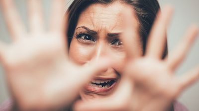 Woman expressing a scared, terrified emotion