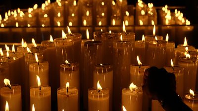 Candles Burning On Table In Church