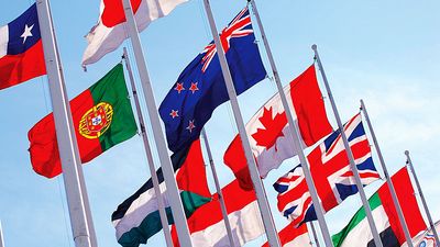 Flags of the world against blue sky. Countries, International. Globalization, global relations, Australia, Canada, United Kingdom, Poland, Palestine, Japan. Homepage 2010, arts and entertainment, history and society