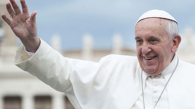 Vatican City, Rome, Italy - November 13, 2013: Pope Francis on the popemobile blesses the faithful in St. Peter's Square.