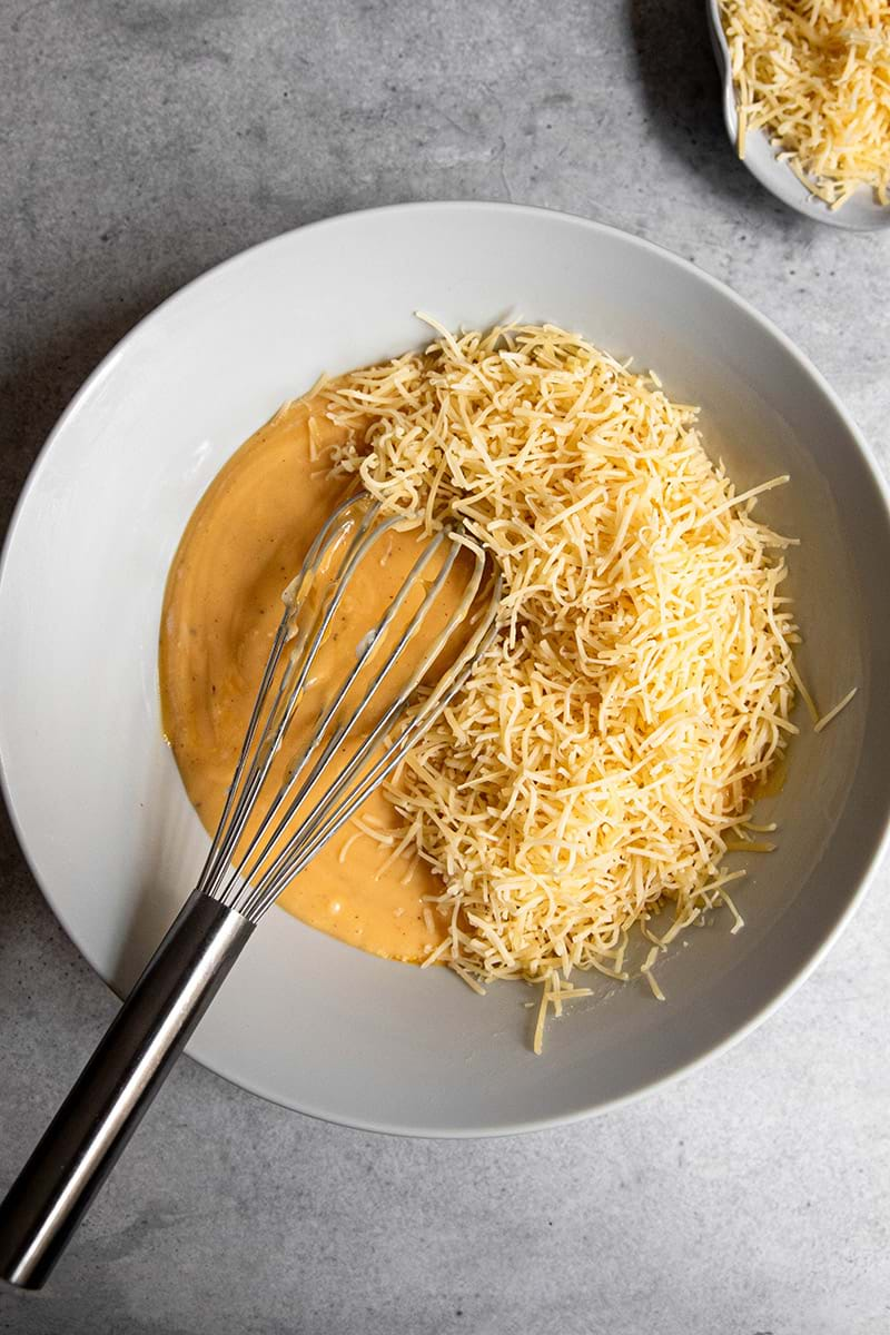 Overhead shot of bechamel and egg yolk mixture with cheese