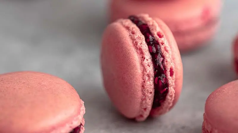 Raspberry macaron filled with homemade raspberry jam