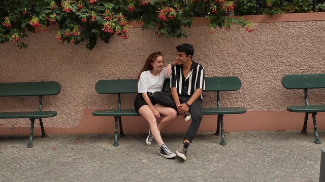 Couple relaxing on bench