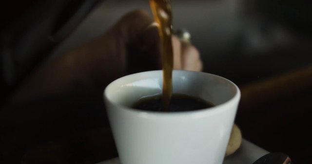 Pouring coffee into a mug