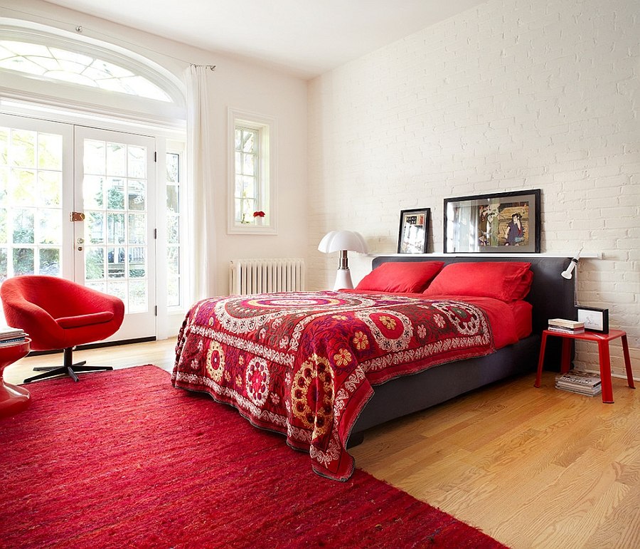 Brick wall in white gives the bedroom textural contrast [Design: Stephane Chamard]