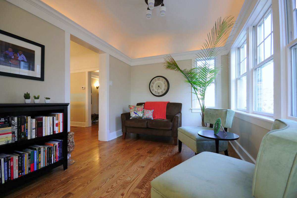 Pops of red in a taupe sitting room