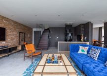 Industrial-living-room-with-brick-wall-and-bright-blue-couch-217x155