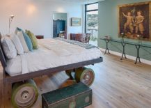 Unique-bespoke-bed-on-giant-wheels-with-industrial-style-217x155