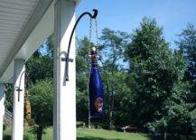 Bottles hanging from house pillars