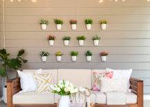 Hanging white pots with flowers