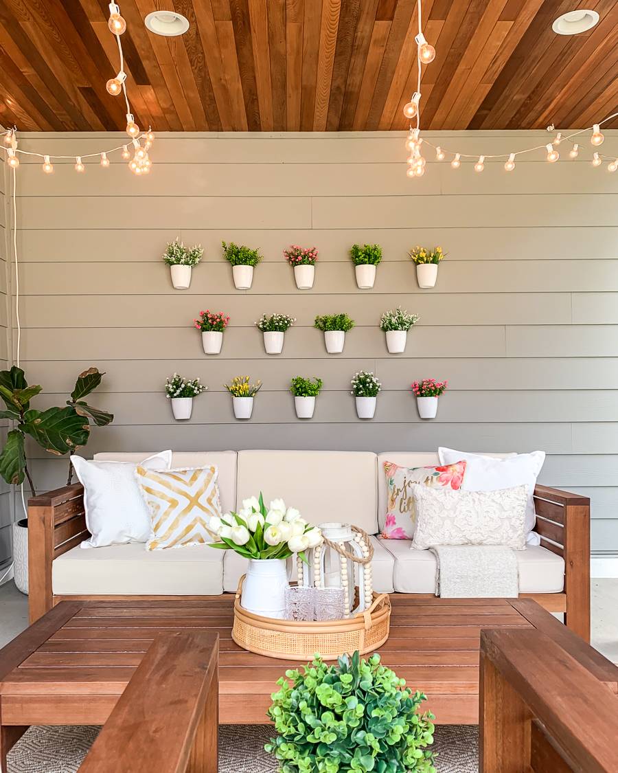 Hanging white pots with flowers