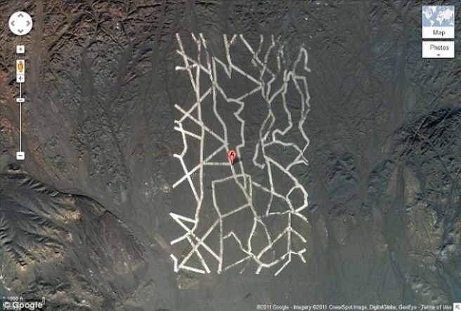 These rectangles, up to a mile long, can be seen from space near the Gansu province and Xinjiang, China.

We're not sure what's up, but someone should definitely check it out.