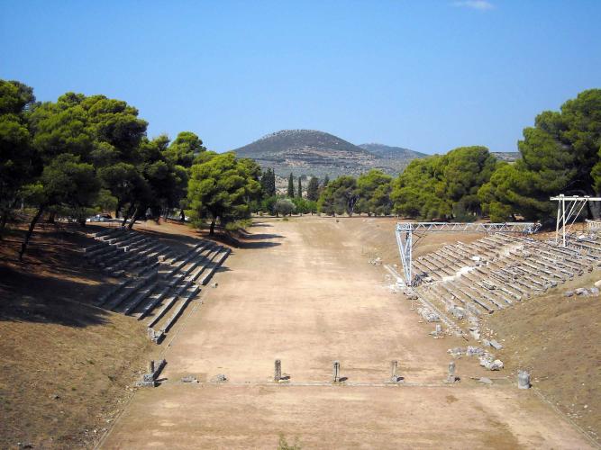 The stadium, built in the 4th century BCE, held athletic games and may have also held performances before the theatre was built. – © Hellenic Ministry of Culture and Sports / Ephorate of Antiquities of Argolida