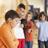 School child being bullied in school hallway