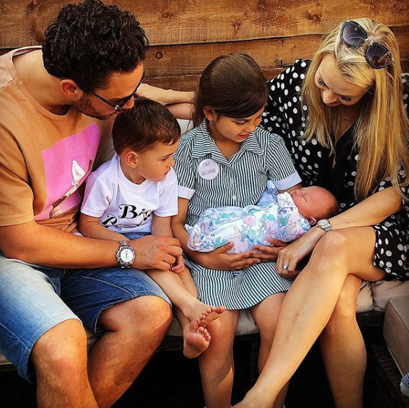 Adam thomas with his children and wife and niece, Scarlett