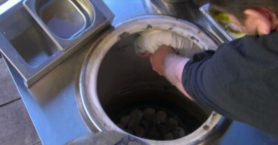 James Martin reaches into the tandoor