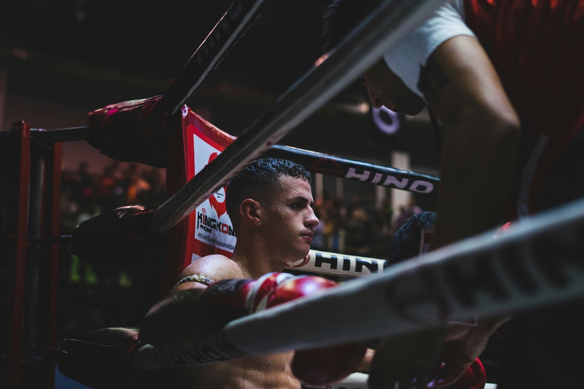 A boxer sitting in a ring corner as an example of boxing photography