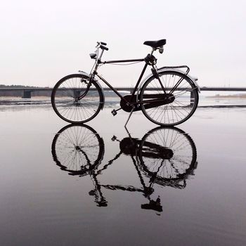 Bike reflected on water