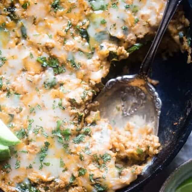 One Pot Mexican Chicken Rice Casserole - This chicken Mexican rice casserole uses sweet potato for extra creaminess! It's a healthy, protein packed, 8 ingredient dinner for busy weeknights that is only 330 calories! | Foodfaithfitness.com | @FoodFaithFit