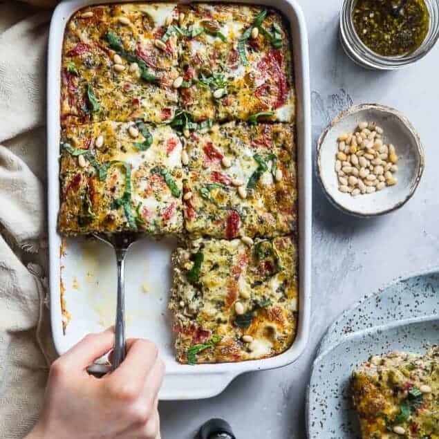 Low Carb Pesto Italian Sausage Breakfast Casserole - This easy, keto-friendly breakfast egg casserole is loaded with cheese and Italian flavors! A perfect, make-ahead breakfast or brunch that's gluten free and healthy! | #Foodfaithfitness | #Keto #Lowcarb #Glutenfree #Healthy #Breakfast