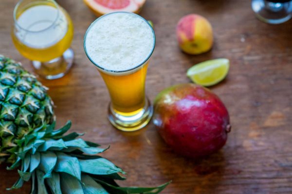 fruit beer on table with fruit