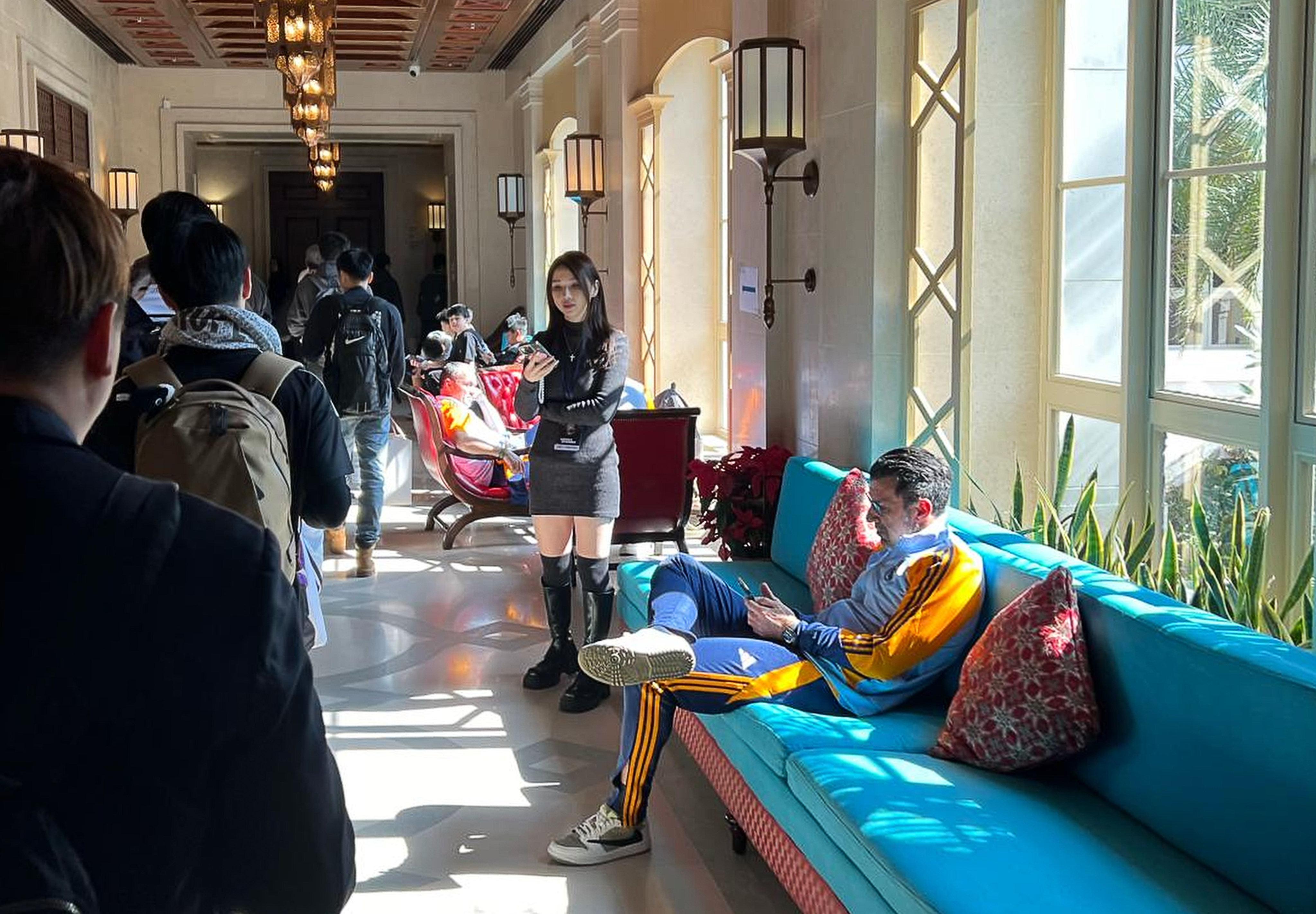 Real Madrid legend Luis Figo sits on a sofa at the Hong Kong Golf and Tennis Academy, while fans hoping to get players’ autographs queue in the corridor. Photo: Handout