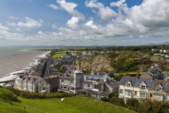 Houses and hotels lining the seafront at the seaside town of Criccieth, North Wales