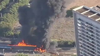 Plane wreckage burns after crashing into bus on busy Sao Paulo road