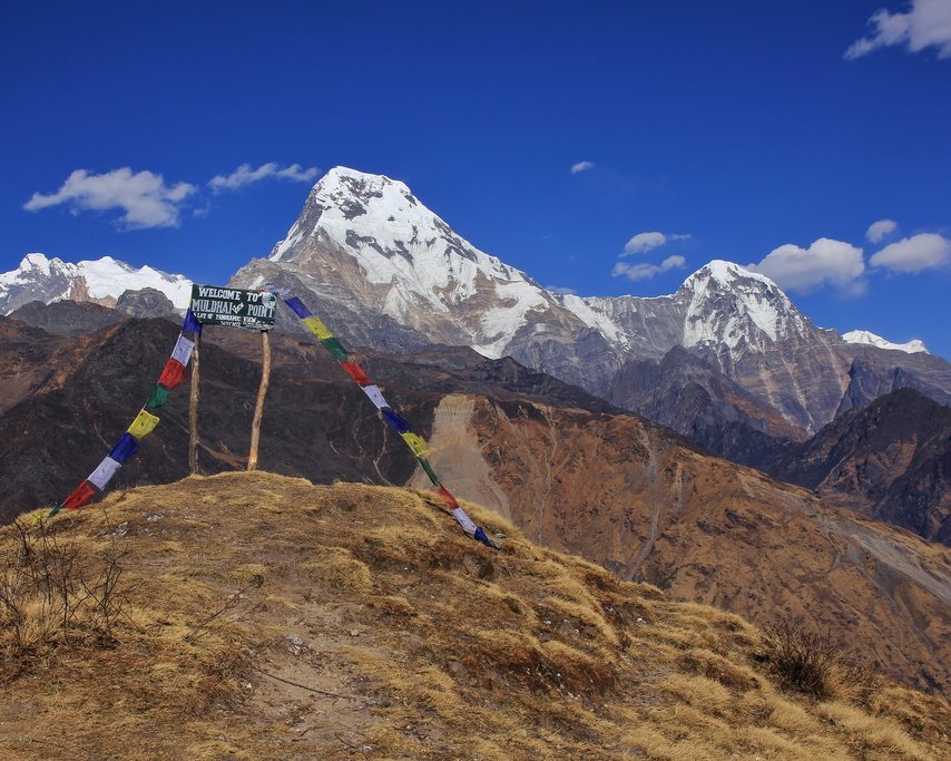 Prayer flags mark Muldai Peak