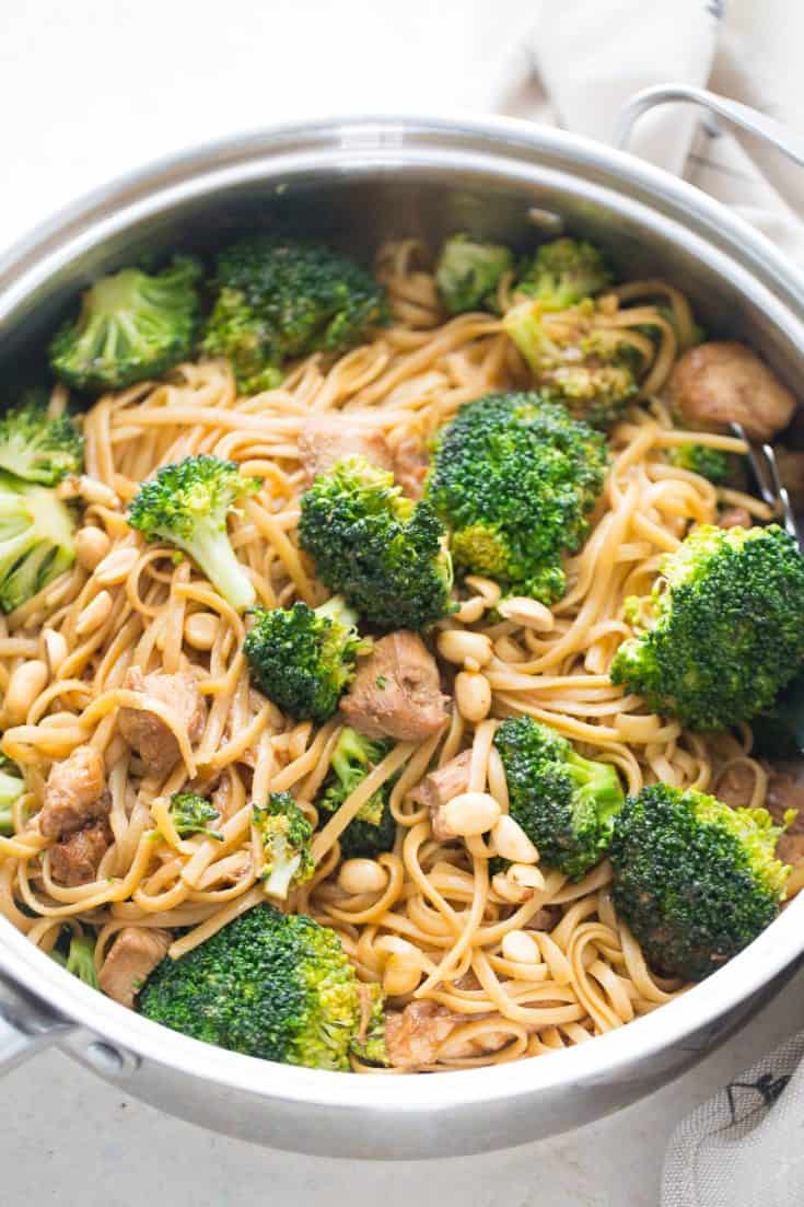 Chicken and broccoli are stir fried together in a simple marinade and then served with peanut butter noodles!