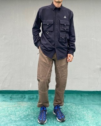 Black and Blue Athletic Shoes Outfits For Men: This combination of a black long sleeve shirt and brown cargo pants is simple, dapper and very easy to imitate. Let your styling prowess truly shine by finishing this outfit with a pair of black and blue athletic shoes.