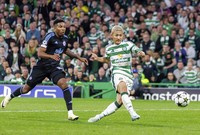 Celtic's Daizen Maeda, right, scores the team's fourth goal in the second half of a Champions League football match against Slovan Bratislava on Sept. 18, 2024, in Glasgow, Scotland. (Kyodo)