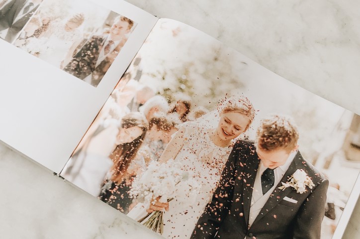 Wedding photo book with photos of newlyweds inside