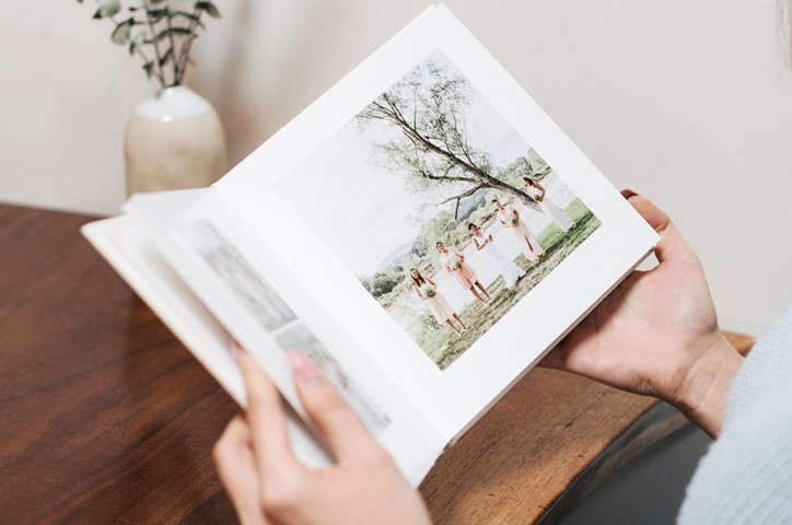 Person holding photo album