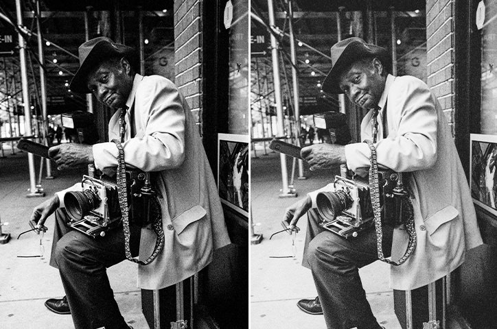 Vintage black and white image of adult man fixing an old film camera