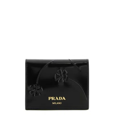 Prada Logo-plaque Floral-embossed Patent Wallet In Black