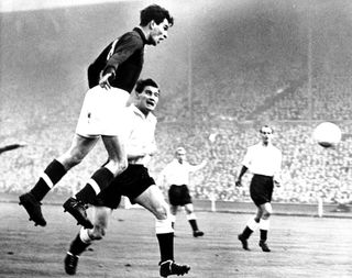 Sandor Kocsis of Hungary heads the ball towards goal during the 'Match of the Century' against England at Wembley in 1953