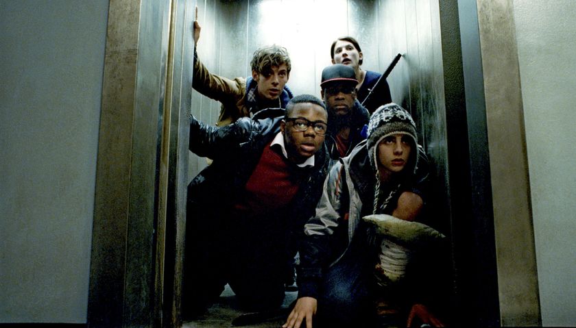 Attack the Block cast posing in a doorway